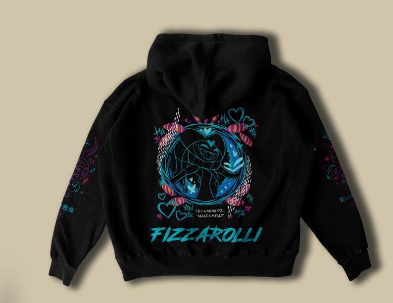 May include: Black hoodie with a graphic design on the back featuring a cartoon character in a blue and pink circular frame. The text "FIZZAROLLI" is in teal, with additional text and heart shapes. Sleeves have colorful patterns.