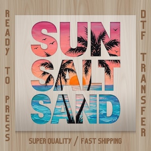 May include: A wooden panel with the words "SUN SALT SAND" cut out, revealing a colorful beach scene. The scene includes a sunset, palm trees, and ocean waves. The words "READY TO PRESS" and "DTF TRANSFER" are printed on the sides.