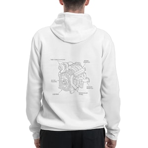 May include: White hoodie featuring a detailed black and white diagram of an engine's internal components, including twin turbochargers, rotor housing, and intake manifold. The text labels the parts. A casual, comfortable garment.