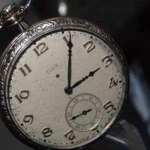Elgin 12 size 7 Jewels In A Gold Filled 14K Case-Keeps Good Time