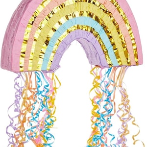 May include: A rainbow-shaped pinata with a pink, purple, blue, yellow, and gold striped design. The pinata has a loop at the top for hanging and is decorated with colorful streamers.