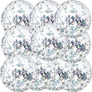 May include: A collection of clear, spherical ornaments filled with iridescent glitter. The glitter reflects various colors, creating a sparkling effect. The ornaments are arranged closely together, filling the frame.
