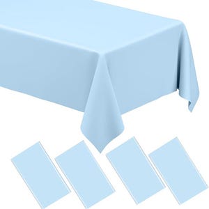 May include: A light blue rectangular tablecloth with matching napkins. The tablecloth is draped over a table, with the corners hanging down. Four light blue rectangular napkins are arranged below the tablecloth.