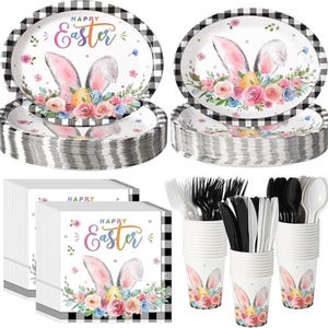 May include: Easter-themed party supplies set. Includes plates, napkins, cups, and cutlery. The plates and napkins feature a bunny ears design with floral accents and the text "Happy Easter". The set has a black and white checkered pattern.