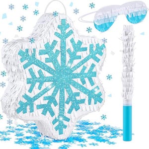 May include: A white snowflake-shaped piñata with a large, glittery blue snowflake design. Includes a matching blue and white eye mask and a white and blue piñata stick. Blue confetti in the shape of snowflakes is scattered around the piñata.