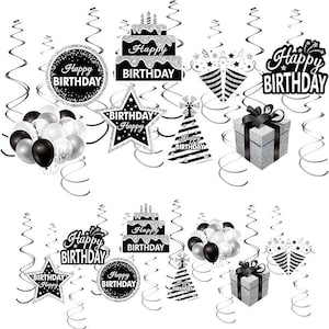 May include: Black and silver birthday party decorations with swirls, stars, cakes, hats, and balloons. The decorations have the text "Happy Birthday" on them.
