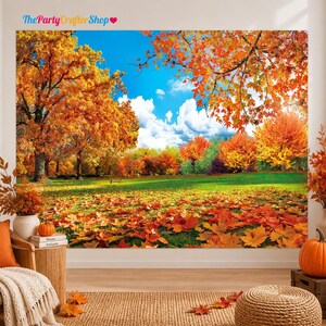 May include: A large wall tapestry featuring a vibrant autumn landscape with golden and orange trees, a green grassy field covered in fallen leaves, and a bright blue sky with white clouds. The scene depicts a park setting during fall.