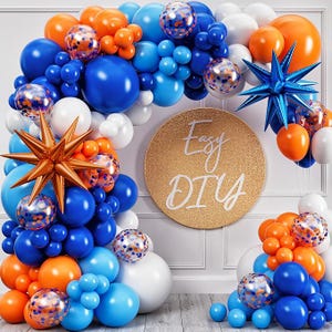 May include: A balloon arch in shades of blue, orange, and white, with star-shaped and confetti-filled balloons. A gold circle with "Easy DIY" text is in the center. Perfect for a party or celebration.