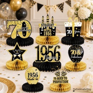 May include: A set of eight black and gold 70th birthday honeycomb centerpieces featuring glittery text and graphics including 70 Happy Birthday, Straight Outta 1956, 70 Years, cheers to 70 years, 1956 Vintage, 70 & Fabulous, 1956 Made in, and 70 Aged to Perfection.