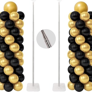 May include: Two balloon columns with black and gold balloons, topped with a large gold balloon. The columns are next to two silver telescopic poles with a white base, designed for balloon displays. A close-up shows the pole's adjustable design.