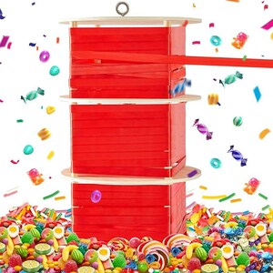 May include: Three-tiered wooden structure with red ribbon spools, topped with a metal ring. Colorful candies and confetti surround the structure, creating a festive and playful scene. The image is bright and vibrant, with a focus on the candy and ribbon.