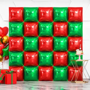 May include: A festive backdrop of red and green square balloons, arranged in a grid pattern. The balloons create a vibrant, celebratory atmosphere, perfect for a party or event. Additional decorations include a small cake, gifts, and balloons.
