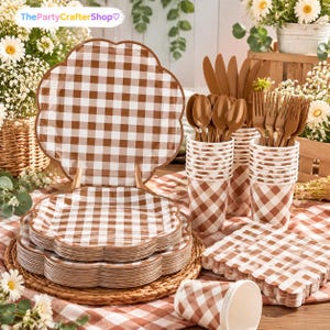 May include: A set of disposable party supplies featuring a brown and white gingham pattern. The collection includes scalloped-edge paper plates, paper cups, and brown plastic cutlery consisting of forks, spoons, and knives arranged in holders.