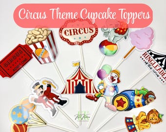 May include: A collection of circus-themed cupcake toppers. Designs include a circus tent, popcorn, a ticket, a clown, an elephant on a ball, cotton candy, and a lion. The toppers are on white sticks and feature the text "Circus".