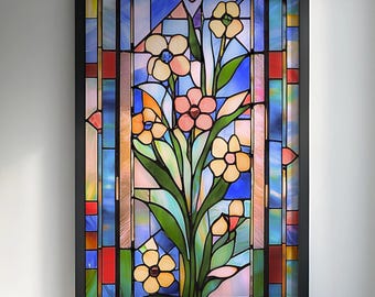 Könnte beinhalten: Ein gerahmtes Buntglasfenster mit floralem Design. Das Kunstwerk zeigt einen Blumenstrauß in Rosa- und Gelbtönen, vor einem Hintergrund aus blauem, rotem und grünem Glas. Der Rahmen ist schwarz.
