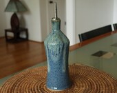 Ceramic oil bottle with blue and green glazes, handmade by Jason Hooper Pottery