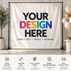 May include: A white fabric backdrop banner suspended on a black metal stand. The banner features the black text YOUR DESIGN HERE with a rainbow-colored gradient on the word DESIGN, followed by the text LOGO • TEXT • PHOTO • ARTWORK.