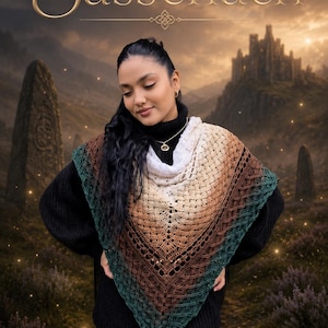 May include: A triangular crochet shawl featuring a gradient color pattern that transitions from white at the neck to tan, brown, and deep teal at the edges. The shawl has an intricate, open-work textured stitch pattern and is worn over a black sweater.