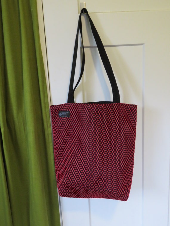 black tote with red lining
