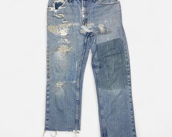 Distressed reworked light blue denim lee jeans