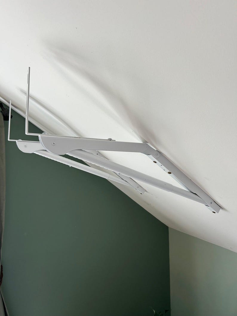 a white bracket on a wall