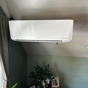 a white air conditioner in a room