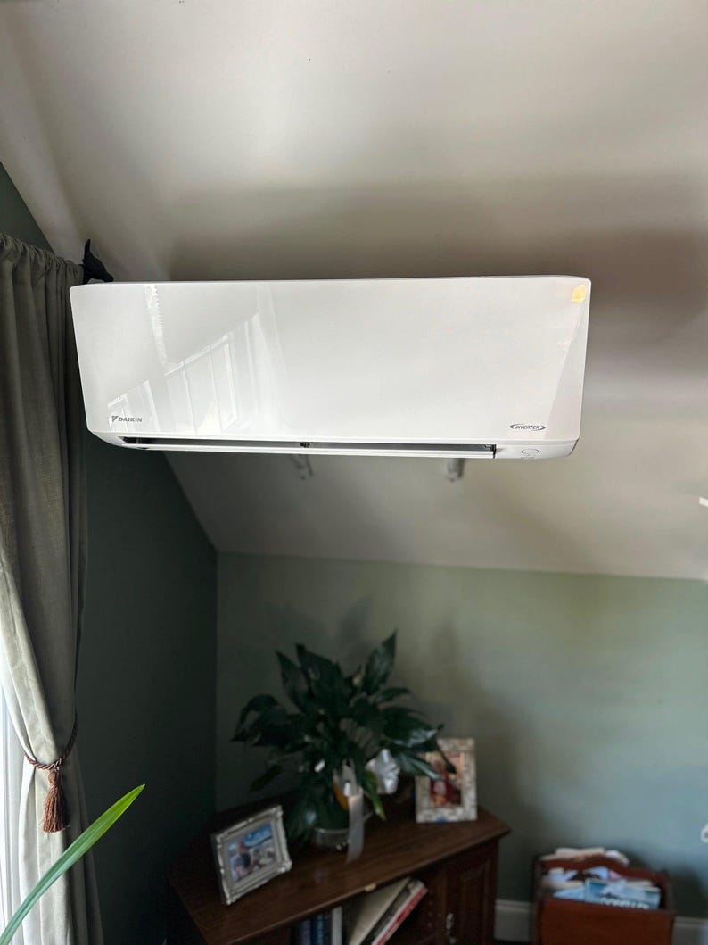 a white air conditioner in a room
