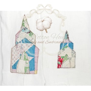 May include: White fabric with two patchwork church designs in pastel colors. A cotton boll and decorative bow are above the churches. The text "The Cotton House Sewing and Embroidery" is visible.