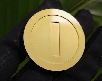 Moeda de metal do Mario Bross