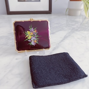 May include: A set of three ceramic mugs with a speckled, matte finish. Each mug features a different color: light blue, cream, and gray. The mugs have a simple, modern design with a rounded shape and a comfortable handle.