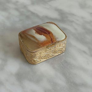 Vintage Rectangular Gold Toned Pill / Snuff Box With Onyx Lid and Floral Design Pill Box