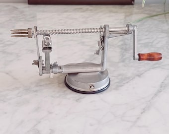 Vintage apple peeler, corer, and slicer with protective cover