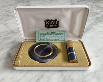 Set de polvera y atomizador Kigu vintage en caja original, color azul y dorado. Set de regalo para tocador.