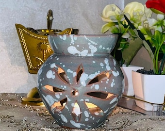 Quemador de incienso gris moteado para decoración zen del hogar.