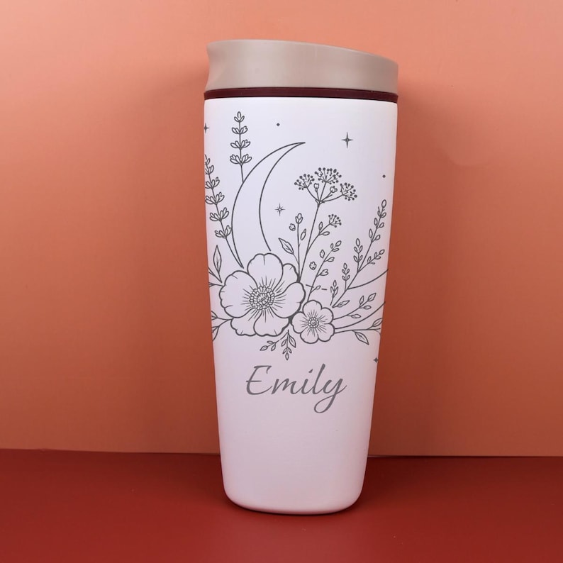 Personalized wildflower Owala SmoothSip bottle with laser engraved moon and celestial details. The custom name adds a special keepsake touch, while the floral design gives the travel coffee cup a soft cottagecore and boho feel, perfect for birthdays, friendship gifts, and cozy everyday drinkware.