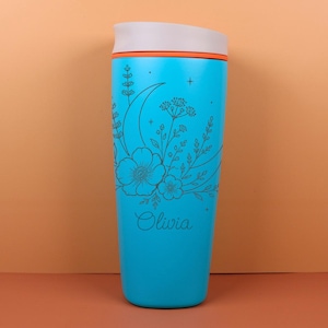 Engraved Owala SmoothSip bottle with a custom name surrounded by delicate wildflowers, moon details, and celestial accents. The design has a dreamy whimsical style that makes it a beautiful personalized birthday gift, best friend gift, or cozy travel coffee cup for daily use at work, school, or on the go.