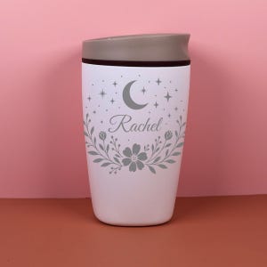 A personalized Owala SmoothSip bottle featuring a custom name in elegant script surrounded by delicate floral and celestial elements, including moons and stars, creating a dreamy boho aesthetic perfect for daily hydration or coffee on the go.