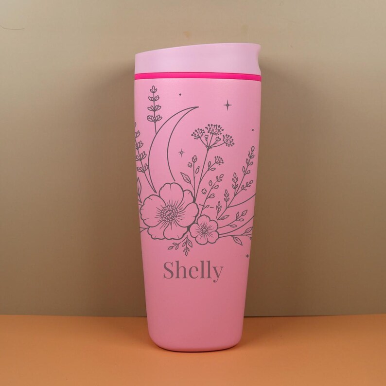 Whimsical Owala SmoothSip travel coffee cup engraved with a custom name and moon wildflower design. This personalized bottle has a soft celestial floral style that makes it perfect for gifting to a best friend, sister, mom, coworker, or birthday girl who loves cozy and meaningful accessories.