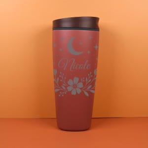 Personalized Owala bottle displayed on a neutral background, highlighting a custom name in a modern font paired with delicate florals and moon phases, ideal for gifting or elevating your everyday drink routine.