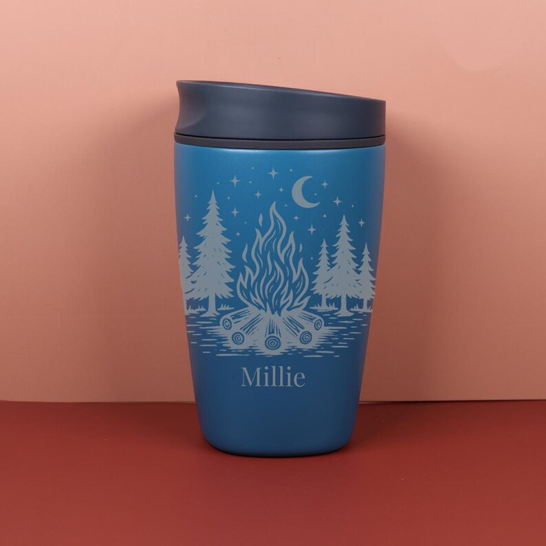 Custom name Owala SmoothSip travel cup with a celestial camping design inspired by moonlit adventures, campfire memories, and star-filled skies. The engraved details create a lasting personalized look for a practical and giftable coffee cup made for outdoor-loving spirits.