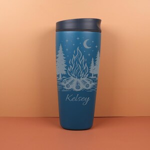 Whimsical custom Owala SmoothSip travel coffee cup with engraved celestial camping details, including stars and night-sky inspired accents. Personalized with a name, this cup is perfect for women who love camping, hiking, stargazing, cozy drinks, and unique outdoor-themed gifts.