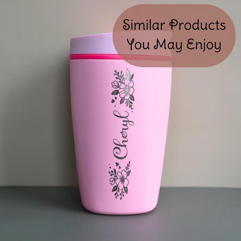 May include: A pink travel mug with a light purple lid and a red accent. The mug features a floral design and the name "Cheryl" in a script font. The text "Similar Products You May Enjoy" is in a brown oval.