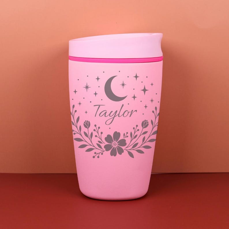 A personalized Owala tumbler featuring a name in elegant lettering surrounded by floral and celestial patterns, perfect for gifting on birthdays, holidays, or as a bridesmaid proposal.