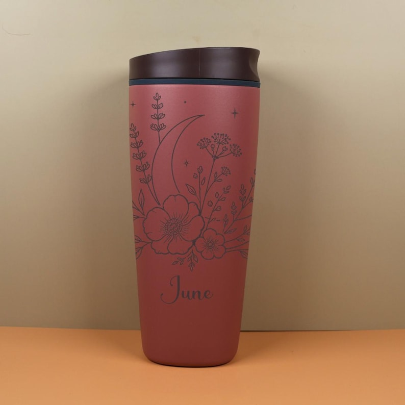 Engraved travel coffee cup on an Owala SmoothSip bottle featuring a custom name with moon, floral, and wildflower artwork. This personalized celestial design is ideal for gifting to a best friend, sister, coworker, or birthday recipient who loves magical details, nature inspired style, and useful drinkware.