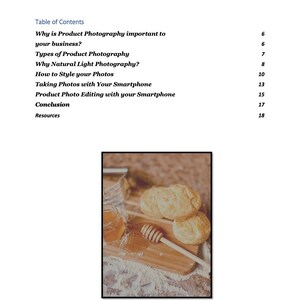 May include: A close-up of a wooden cutting board with three golden brown biscuits, a jar of honey, and a honey dipper. The biscuits are arranged in a stack, and the honey is drizzled over the top biscuit. The cutting board is covered in a light dusting of flour.
