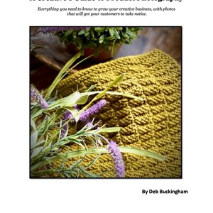 May include: A close-up of a knitted yellow dishcloth with purple flowers on top. The dishcloth is made with a textured stitch pattern.