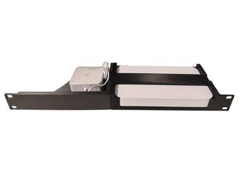 May include: A black rack mount shelf with a white device and a silver device with a white power cord. The shelf has a rectangular shape with mounting holes on the sides. The devices are secured within the shelf.