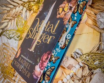Metal Slinger  - UK paperback and  Hardback Custom Hand Sprayed Edges | Fantasy Books