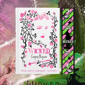 May include: A book cover and bookmark featuring the title "Wicked" by Gregory Maguire. The book cover has a pink and black floral design with a woman's face. The bookmark has a green and pink striped background with witch-themed illustrations.