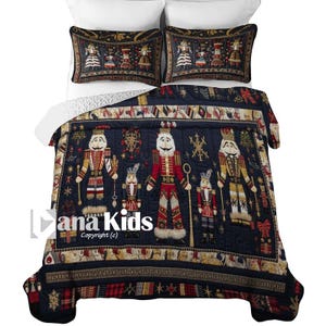 May include: A navy blue quilt set featuring a detailed design of nutcrackers and snowflakes. The set includes a quilt and two pillow shams. The quilt has a border with decorative elements. The text "ana Kids" and "Copyright (c)" are visible.
